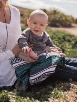 Teal Hand-Made Serape And Sherpa Baby Blanket -Silicone Jewelry & Accessories Accessories.Blanket.Lifestyle1 e7dbfe58 c638 4e39 ad63 fd4ffed4eaf3